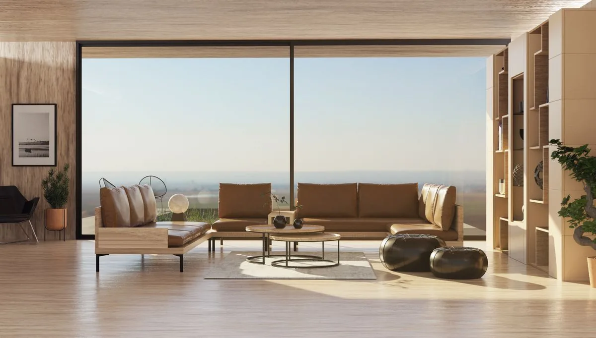 Intérieur lumineux d'un séjour d'extension à ossature bois avec grande baie vitrée coulissante et finitions bois clair